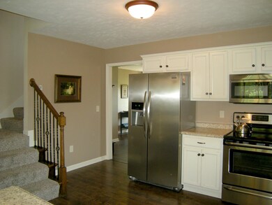 Stairs to bonus room are conveniently located from the kitchen. 