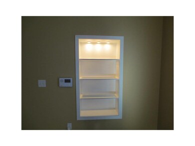 Living Room. Lighted display shelf in living room.