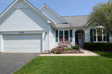 2 car garage and a well manicured lawn.