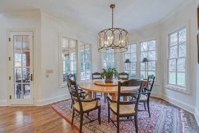 The breakfast nook sits to the rear of the home overlooking the kitchen.  With easy access to the outdoor living room and outdoor kitchen this area is spacious enough for those informal dinners.