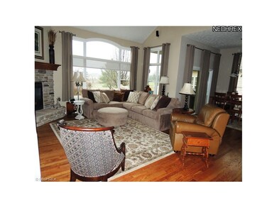2-story great room with hardwood floors and gas fi