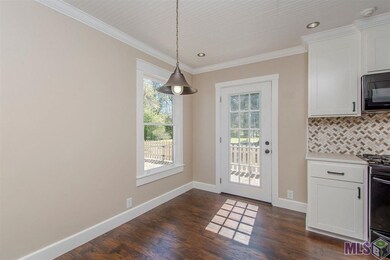 Breakfast area with access to rear fenced yard.