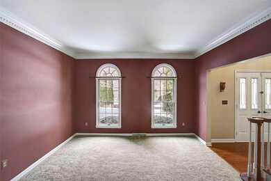 FORMAL LIVING ROOM OPEN TO FOYER & FAMILY ROOM
