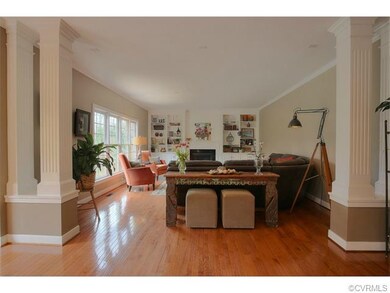 Fluted columns divide the family room from the bre