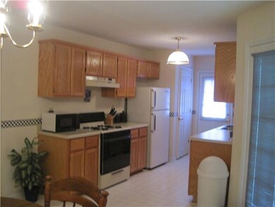 Another view of the kitchen shows the space and the pantry.