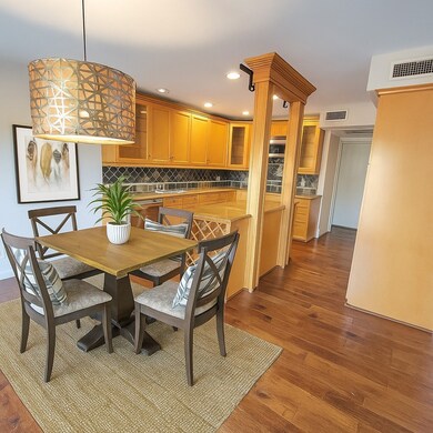 Dining space with recessed lighting and dark wood finished floors