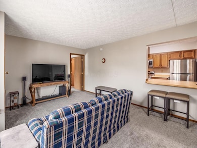 opening to kitchen with stool seating
