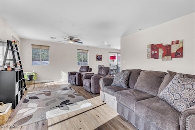 Living room featuring recessed lighting, wood fini