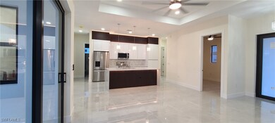 Kitchen with pendant lighting, a kitchen island wi