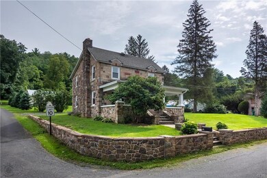 Front of house, stone retaining wall