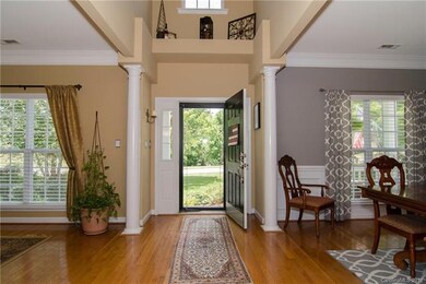 Entry hallway/foyer with wood flooring.