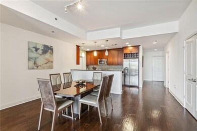 Dining room featuring track lighting and dark hardwood / wood-style flooring