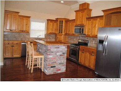 Cypress, granite, brick and stainless adorn the sp