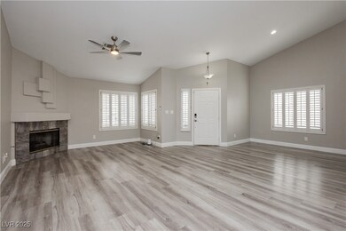 Unfurnished living room featuring lofted ceiling,