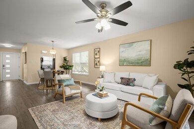 Living area featuring wood finished floors, baseb