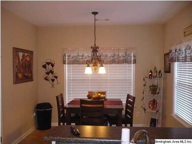 Large eat in kitchen with an island and all applia