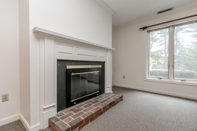 Wood burning fireplace in living rm