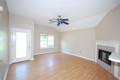 Living Room has laminate flooring & wood burning f