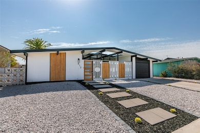 View of front of property featuring concrete drive
