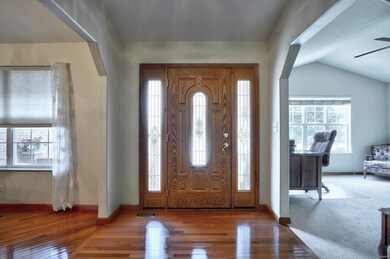 Stunning foyer with hardwood floors.