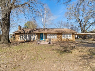 Back of property featuring a carport