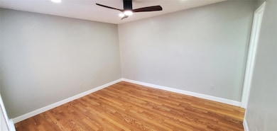 Unfurnished room with wood-type flooring