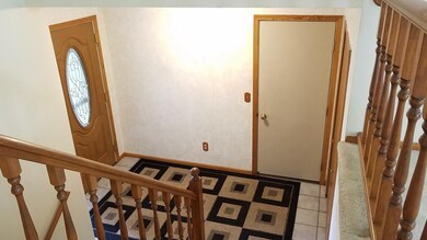 Large foyer shows newer fiberglass entry door, ent