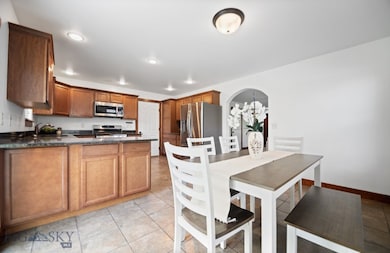 Virtually staged dining+ kitchen