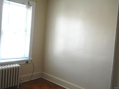 Middle bedroom with hardwood floor