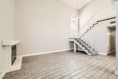 Unfurnished living room featuring visible vents, a