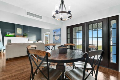 Spacious dining opens up to Livingroom.  French do