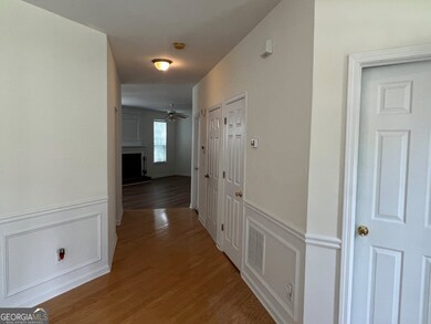 Foyer entry looking down hall to family room