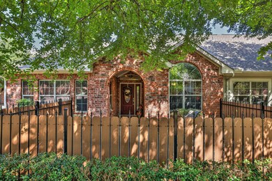 CLOSER VIEW OF COURTYARD AND FRONT ENTRY.