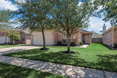 I love how the front door of this 3 bed 2 bath home sits back amongst the mature trees and adds a touch of privacy with the long sidewalk leading up to the home.