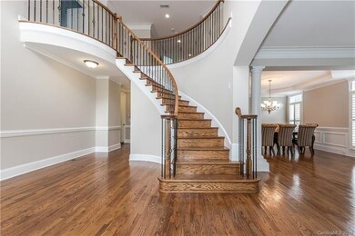 Curved staircase with iron rails