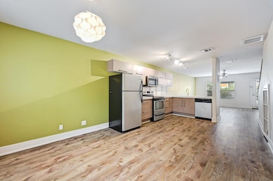 Kitchen featuring appliances with stainless steel