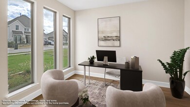 Office space with wood finished floors and baseboards