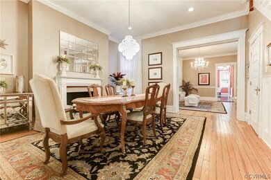 Formal Dining Room with chandelier and fireplace.