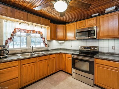 Kitchen with great cabinet and counter space! All SS appliances. Notice the ceiling fan!