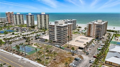 View of apartment building / complex featuring a water view - Virtually Edited Image