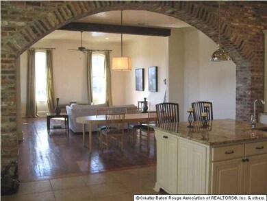 BRICK ARCHWAY LOOKING INTO LIVING AREA