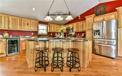 Kitchen boasts plenty of hickory wood cabinetry an