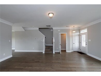Family room.  Gray paint. Hardwood floors. Powder 