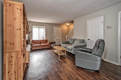 Laundry closet located behind chair. Washer and Dr