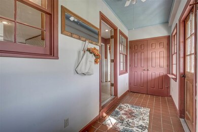 Tiled entrance with large closet on the right perf