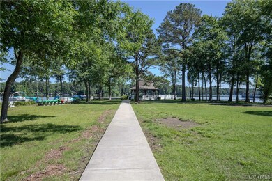 View of nearby features with a yard, a water view,