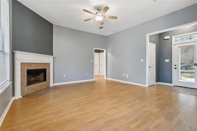 Living room with wood burning fireplace, laminate
