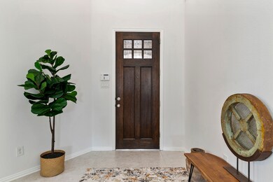 The beautiful dark stained solid wood front door is sure to wow your family and friends.