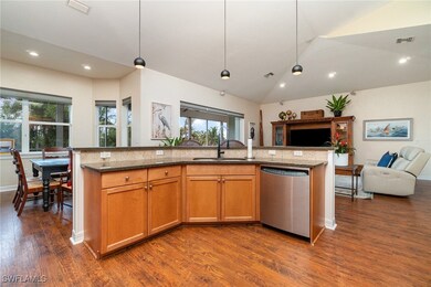 Kitchen with visible vents, dishwasher, dark stone