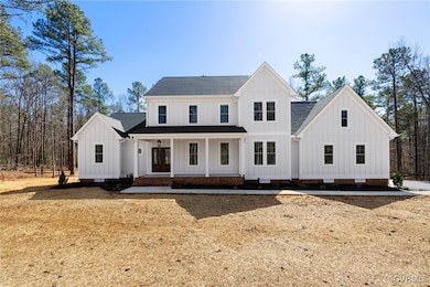 Modern farmhouse with crawl space, a shingled roof, a porch, and board and batten siding